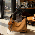 Korean style minimalist suede shoulder bag for women, new autumn 2025 collection, large capacity, fashionable niche design, commuter crossbody bag