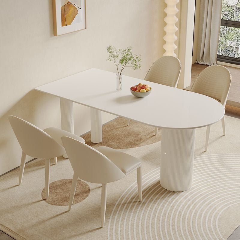 Creamy white rock slab dining table and chair set - modern minimalist semi-circular dining table for small spaces