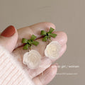 Small fresh green earrings for women niche stylesense of designcasual earrings classy sense tea series early spring earrings wholesale