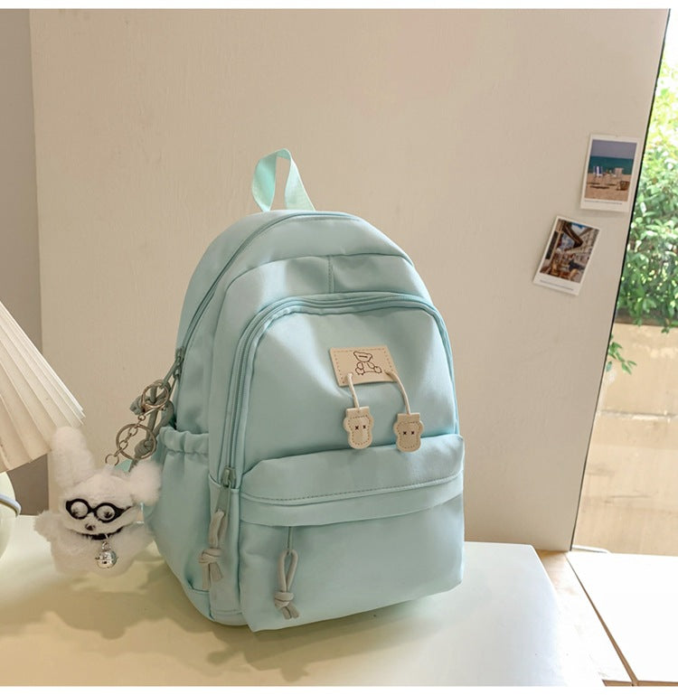 School bag female college student Korean version ins solid color simple and versatile junior high school student travel small backpack high school student backpack