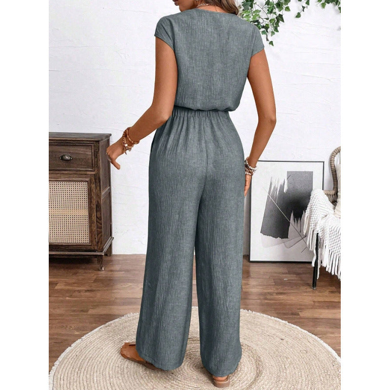 Women's v-neck short sleeve jumpsuit with button-front, elastic waist, wide leg, and pockets - perfect for everyday casual wear