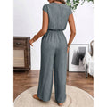 Women's v-neck short sleeve jumpsuit with button-front, elastic waist, wide leg, and pockets - perfect for everyday casual wear