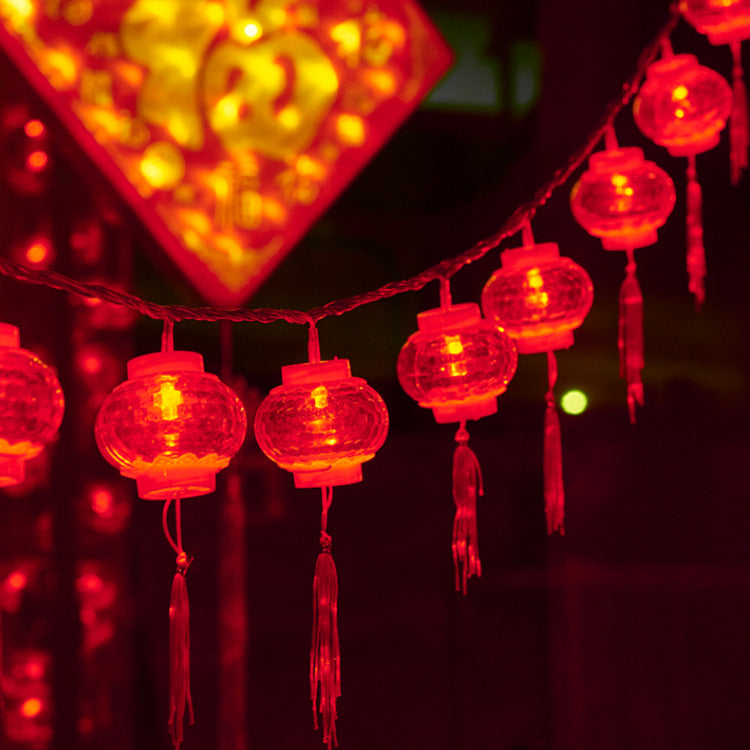 LED lantern string, Chinese New Year lanterns, Spring Festival flashing lights, festive Lantern Festival, New Year's fringed red lanterns