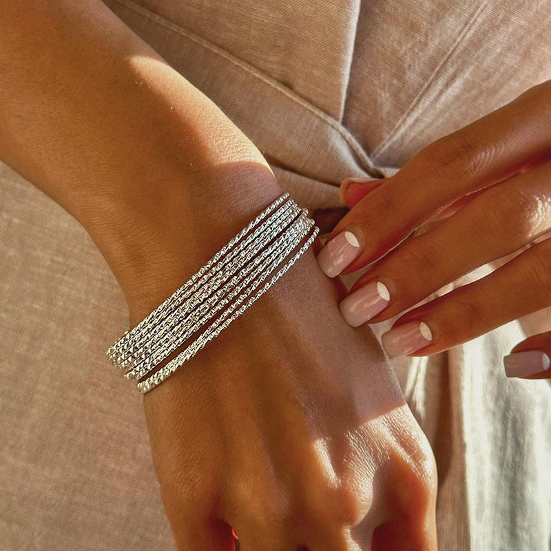 Wholesale alloy bangle sets for cross-border e-commerce: fashionable, small, multi-layered, plain circle bracelets for women (european & american style)