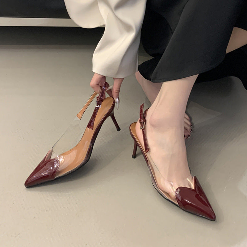 Pointed-toe stiletto sandals for women, 2026 heart-patterned patent leather, transparent open-back, single-strap buckle high heels, wholesale summer quick return