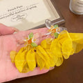 Vacation-style yellow floral fabric earrings for women, beachy colorful face-framing small earrings, statement earrings, unique and eye-catching ear accessories
