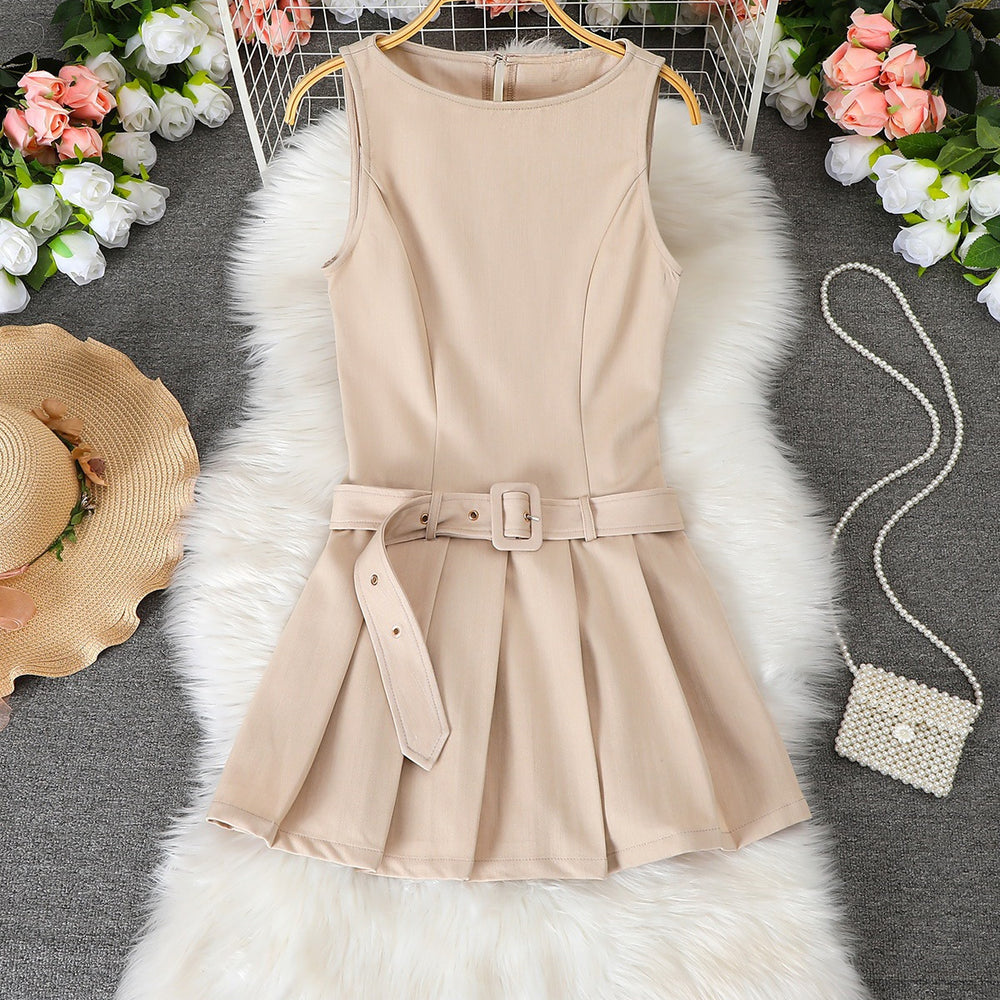 Women's sleeveless pleated mini dress with cinched waist, round neck, and belt – a chic and versatile work-ready style