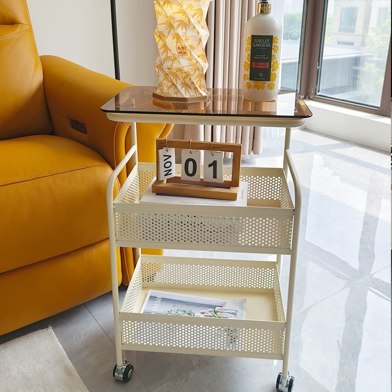 Cream style living room sofa next to several popular snacks multi-layer storage rack bedroom bedside table storage rack trolley