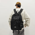 Trendy high-street water-resistant lightweight backpack - 26l large capacity student schoolbag, durable with free headphone pouch