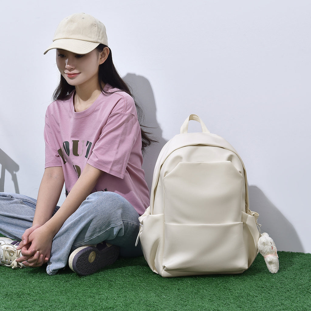 Casual men's and women's same backpack, cute pendant, student backpack, daily leisure large-capacity multi-functional backpack.
