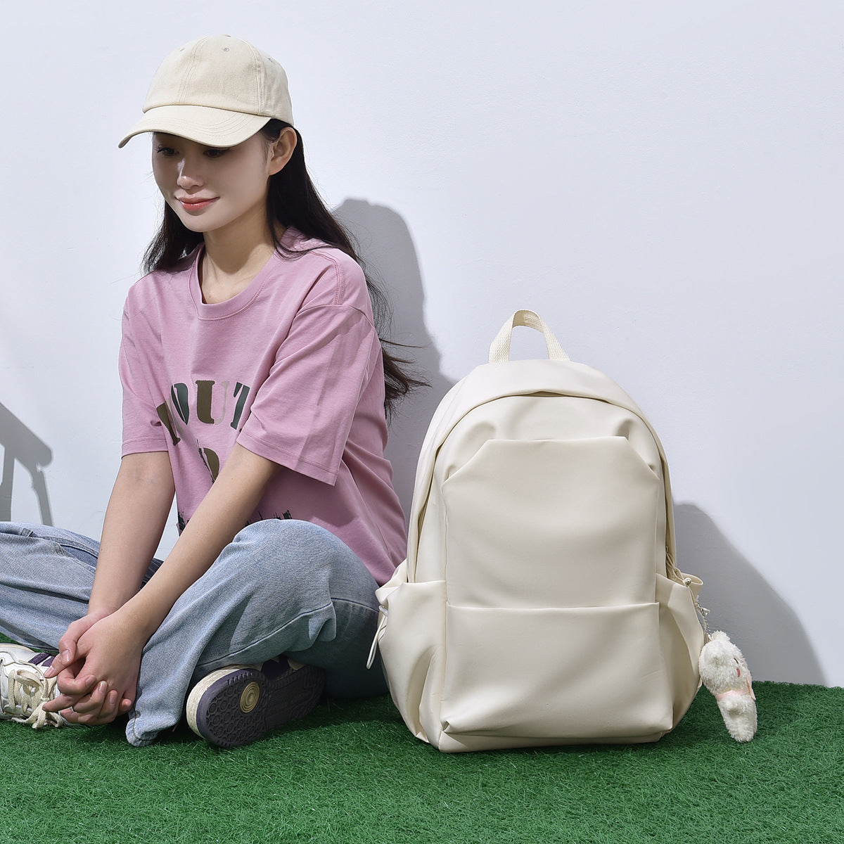 Casual men's and women's same backpack, cute pendant, student backpack, daily leisure large-capacity multi-functional backpack.