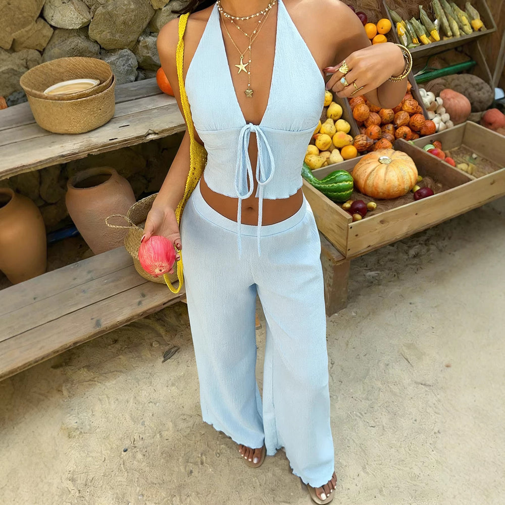 European and american cross-border lazy vacation style set: light blue halter neck tie crop top with high-waisted wide-leg pants two-piece outfit