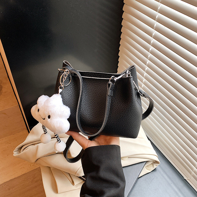 Foreign trade advanced sense bucket bag 2025 summer new niche design light daily commuting hand carry messenger bag