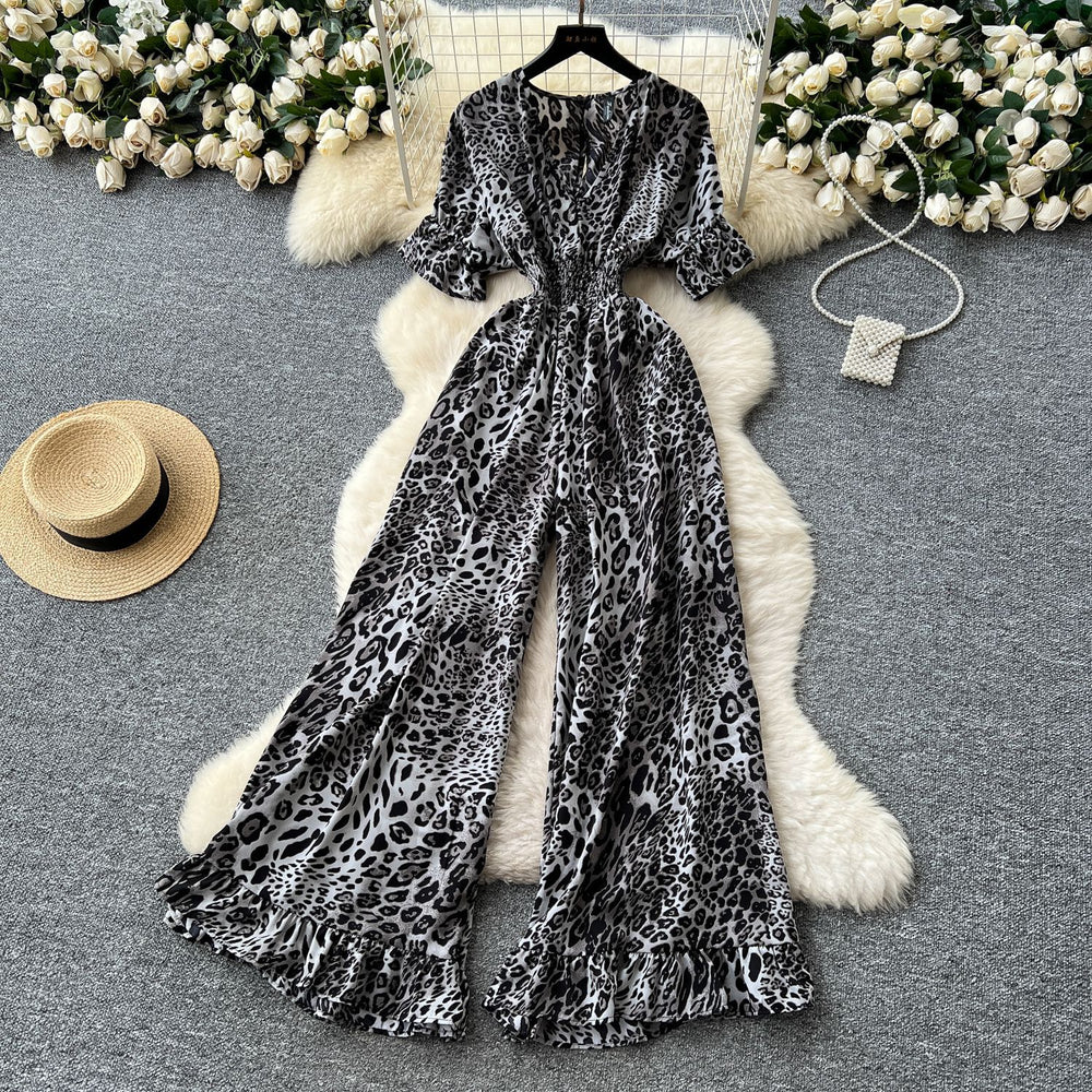 Summer vacation chic: effortless & mature casual v-neck short sleeve jumpsuit with elastic waist, high waist, slimming wide leg, and printed design