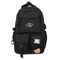 Minimalist korean style fashion casual backpack for high school and college students, featuring cute cartoon badges and large capacity