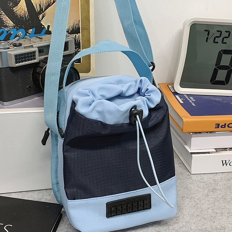 Foreign trade leisure shoulder bag Unisex color matching drawstring bucket bag Anti-splashing double compartment Lightweight portable messenger bag