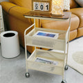 Cream style living room sofa next to several popular snacks multi-layer storage rack bedroom bedside table storage rack trolley