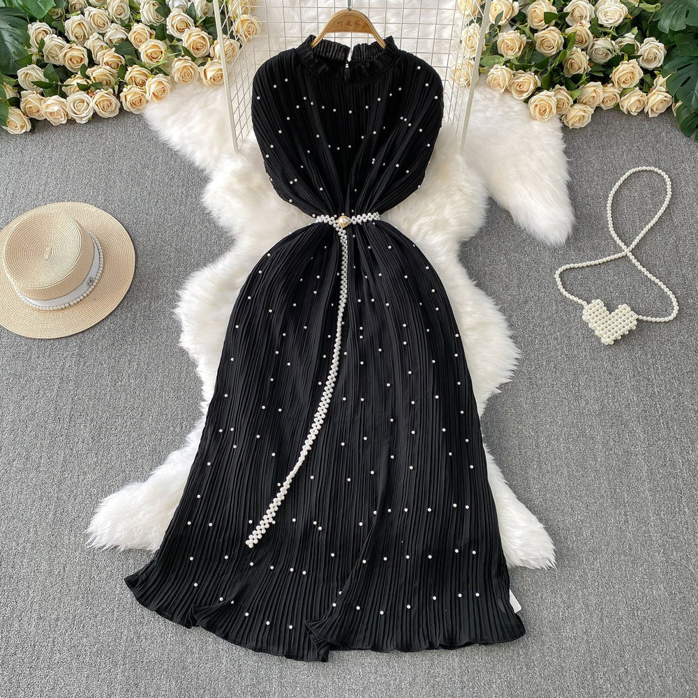 Elegant and sophisticated, this heavy-beaded, ruffled-edge, round-neck dress is a stunning new addition to your summer wardrobe. designed to flatter, it features a cinched waist and a slimming silhouette, finished with a pleated maxi skirt