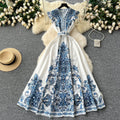 European and american style high-end elegant dress with flutter sleeves, cinched waist, v-neck, single-breasted button detail, and printed design - vintage long dress