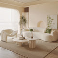 Curved, uniquely shaped, cream-toned sofa – a creative and sophisticated addition to clothing stores, beauty salons, office break rooms, and reception areas