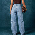 European and american style women's washed denim jeans with metal rivet embellishments, high waist, split seam detail, relaxed fit, and wide leg design