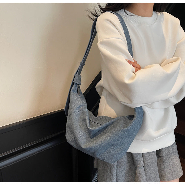 Cross-border solid color dumpling bag 2025 new Korean version fashionable simple shoulder bag niche temperament commuter messenger bag