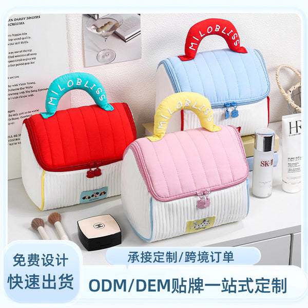 Customized  new cosmetic bag cotton-filled portable small house cosmetic storage bag portable travel skin care product wash