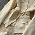 Elegant and chic chanel-inspired two-piece set: women's autumn outfit featuring a tie-waist cardigan and mesh skirt