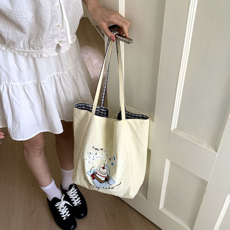 Canvas bag 2025 new women's handheld cloth bag large capacity carrying book bag junior high school students tutoring embroidered shoulder bag