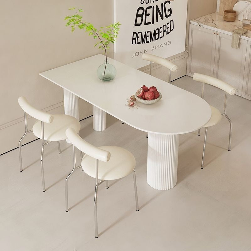 Creamy white rock slab dining table and chair set - modern minimalist semi-circular dining table for small spaces