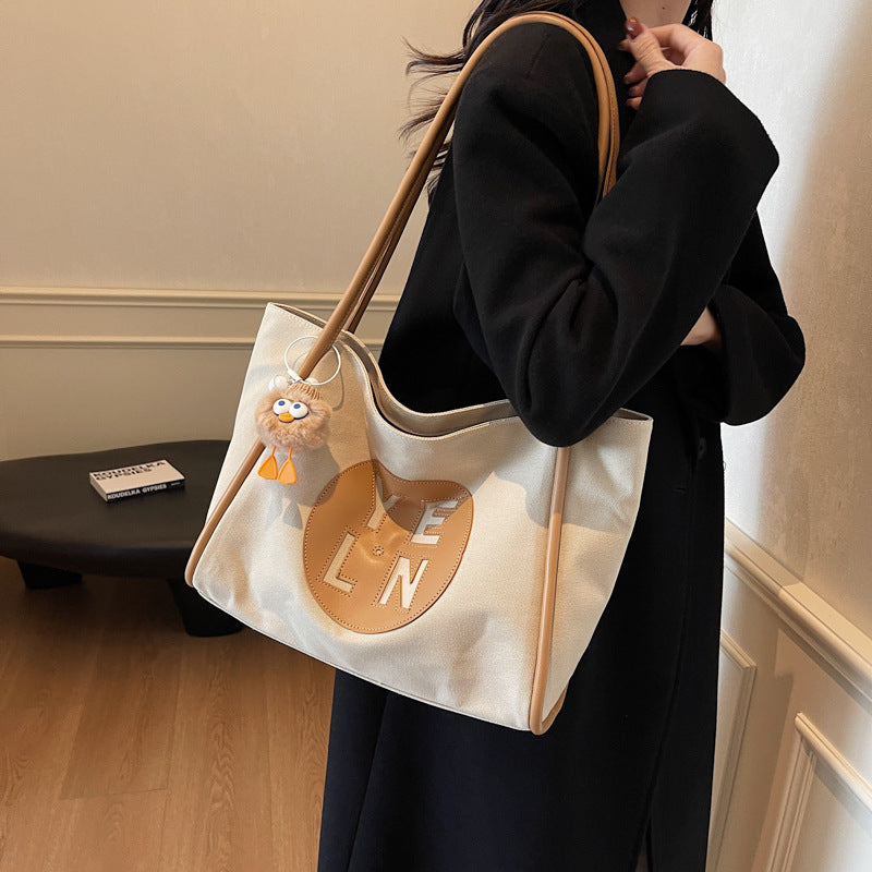 Canvas large capacity letter tote bag women's bag 2025 new casual simple handbag commuter versatile shoulder bag
