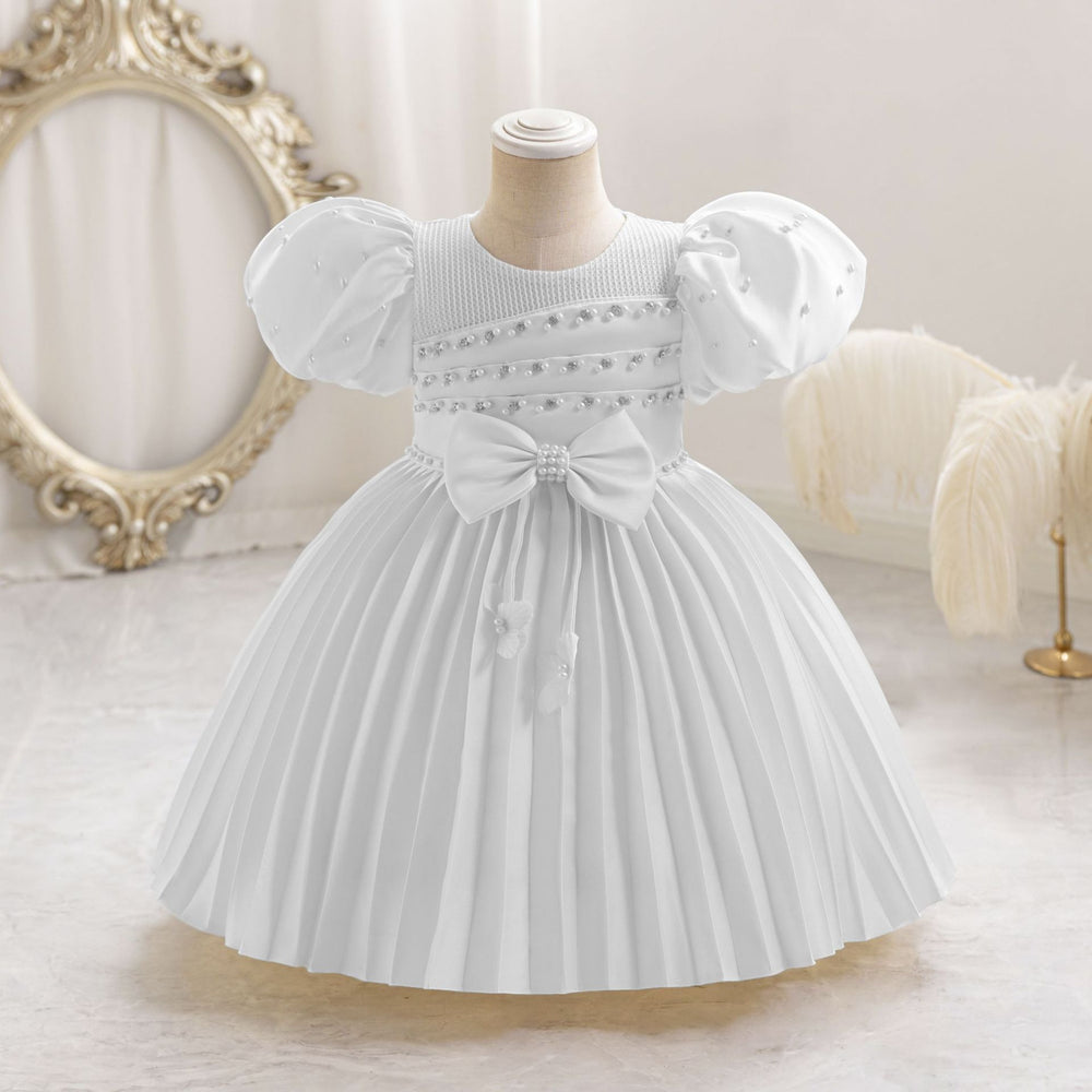 Ready-to-ship wholesale toddler evening gowns, fabric bows, princess dresses, piano recital dresses, and baby dresses