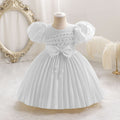 Ready-to-ship wholesale toddler evening gowns, fabric bows, princess dresses, piano recital dresses, and baby dresses