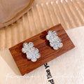 Micro-paved zirconia flower stud earrings - trendy, chic, and effortlessly elegant. a versatile and minimalist accessory for women