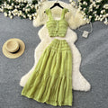 Age-reducing fresh spring and summer holiday style short small flying sleeve suspender tops + high waist pleated skirt two-piece set