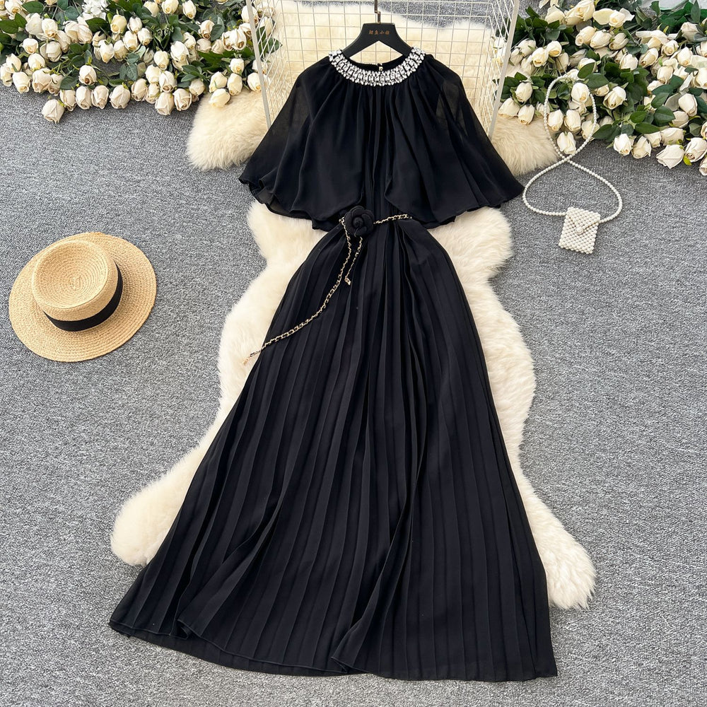 French-style, heavily embellished, beaded and rhinestone-studded, round-neck shawl dress with tie-waist detailing. features a flattering, slimming silhouette and elegant pleated chiffon
