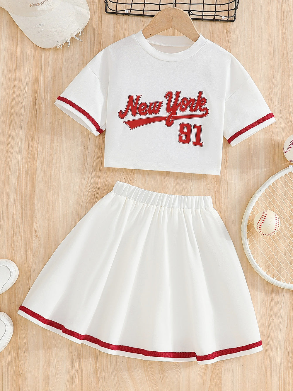 Girls' american style activewear set: white short-sleeve top with lettering and red trim, printed midi skirt - two-piece outfit for girls