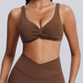 Fashionnew arrivalnude sports intimatesfemale sexy twist shockproof yoga bra beautiful back containing breast pad sports bra