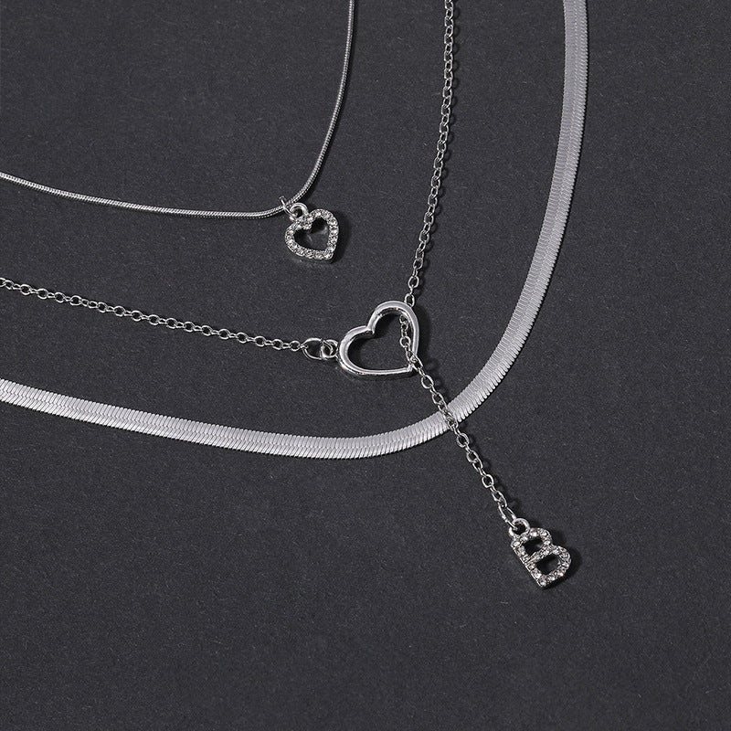 Wholesale alloy diamond-studded letter pendants, european and american cross-border jewelry, multi-layered fashion design heart necklaces for women
