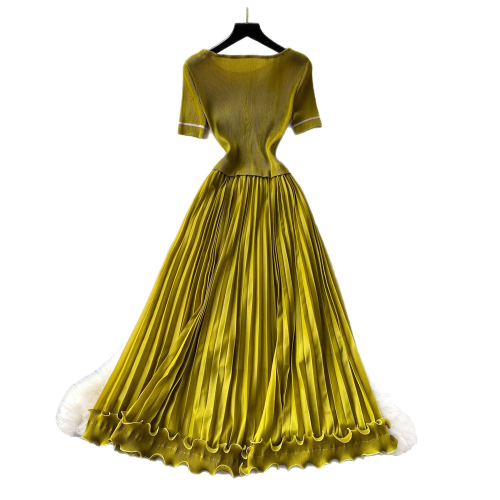 Sophisticated and elegant green pleated dress for women. short-sleeved, waist-cinching, pleated maxi dress, perfect for the office or a sophisticated socialite look