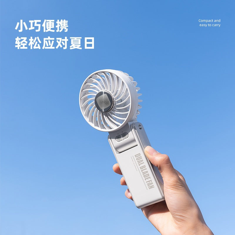 K67 handheld fan, strong wind force, cold compress, foldable color box, various designs, small fan