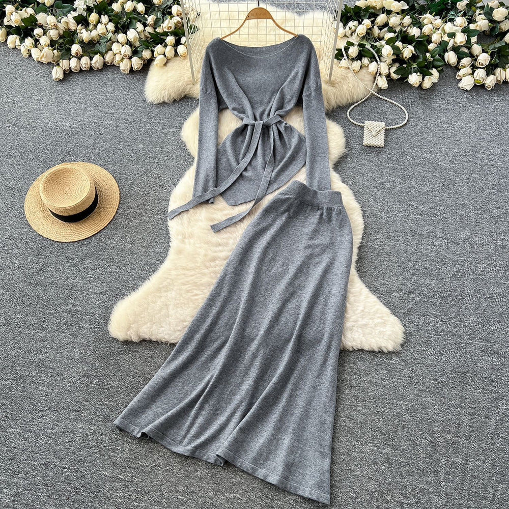 French chic autumn/winter outfit: asymmetrical tie-waist long sleeve knit top + high-waisted midi skirt