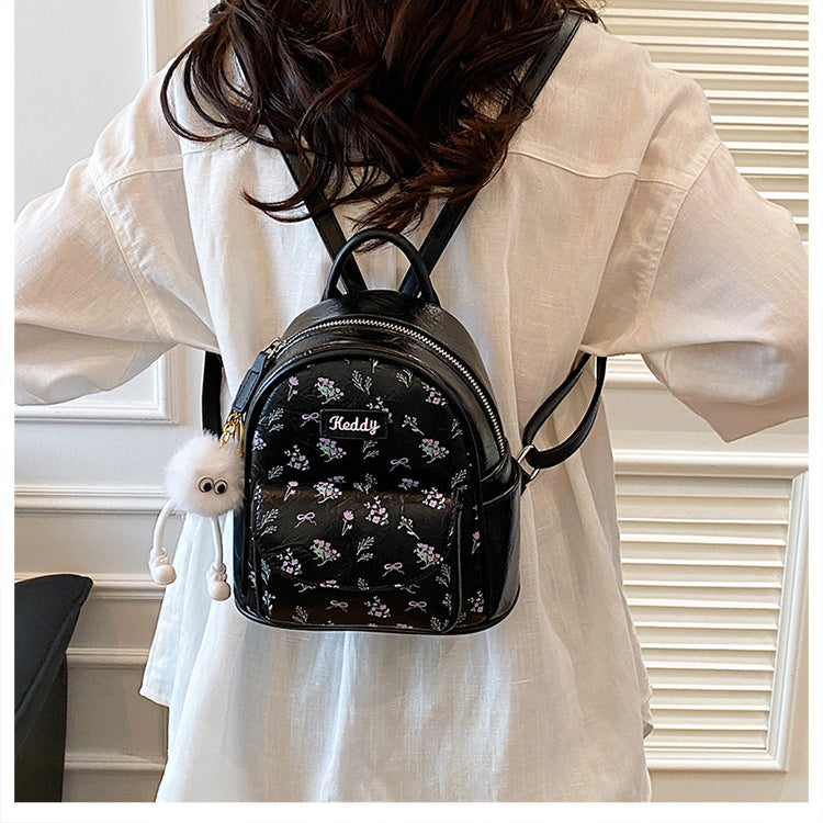 Cross-border backpack women's fashion versatile niche design Korean version student schoolbag casual texture lightweight travel backpack