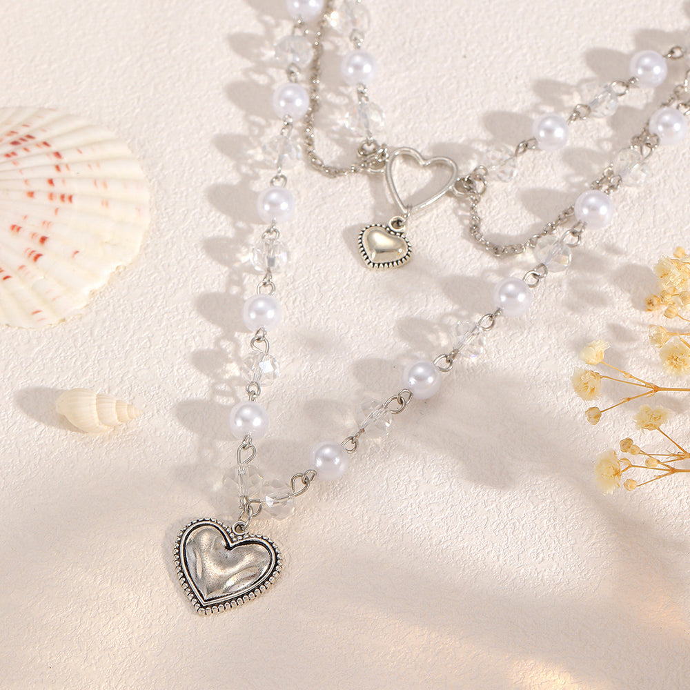 Wholesale faux pearl chains: cross-border fashion, niche, high-end, gothic style heart pendant necklace, sweater chain accessories