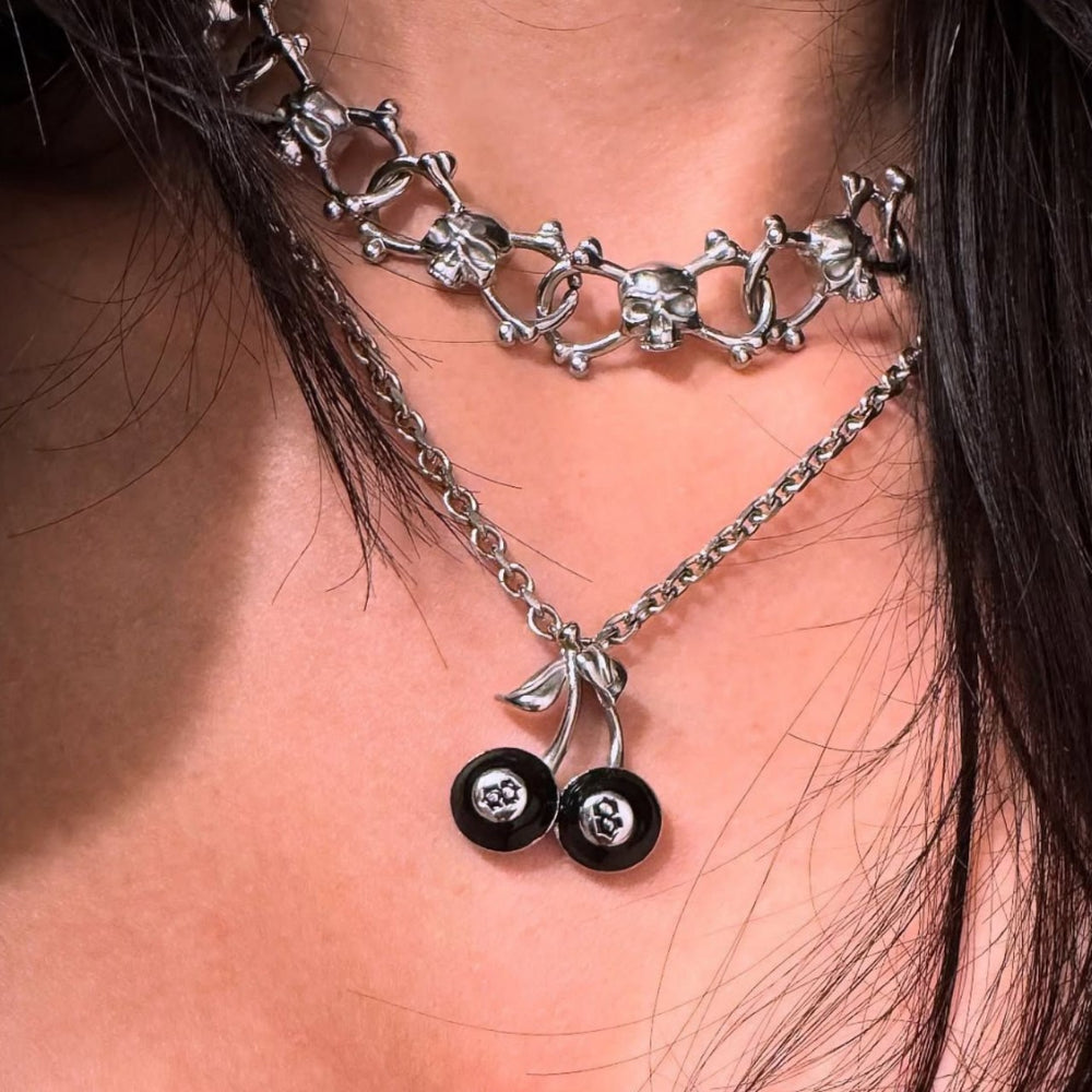 Wholesale necklace accessories: european & american cross-border jewelry - minimalist black cherry & billiard ball pendants, skull necklaces