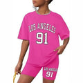 Girls' t-shirt and shorts set featuring a cartoon short-sleeve design and printed graphics, perfect for casual streetwear