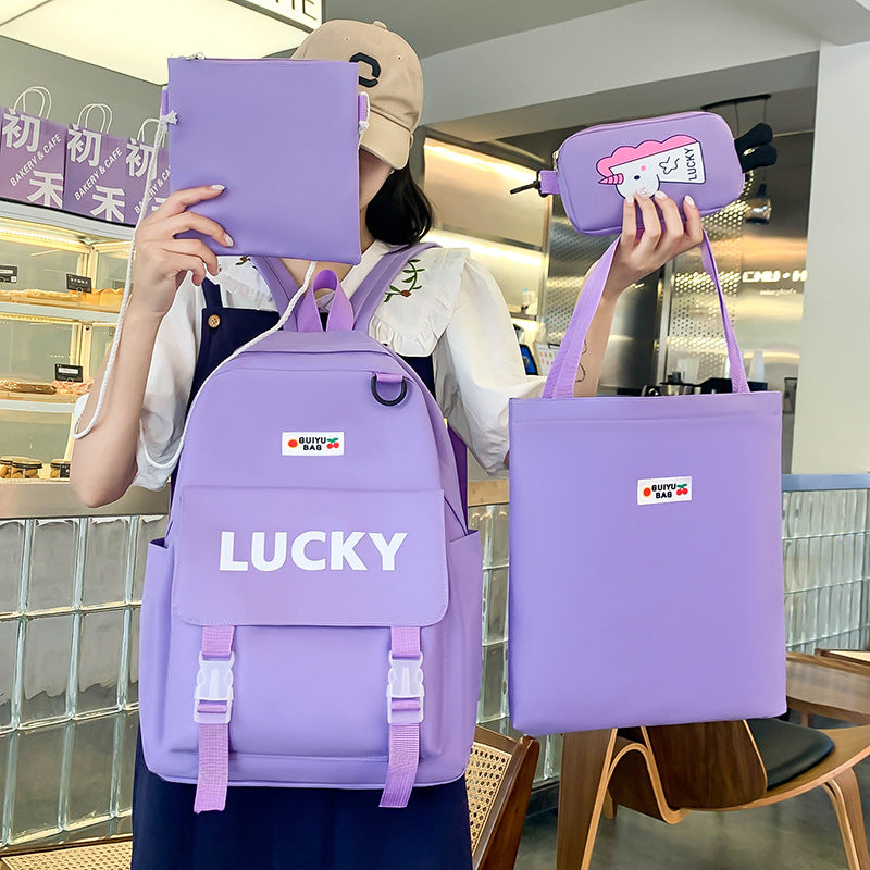 Manufacturer wholesale schoolbag female primary and secondary school students four-piece set third grade Korean version small fresh large capacity backpack to reduce the burden