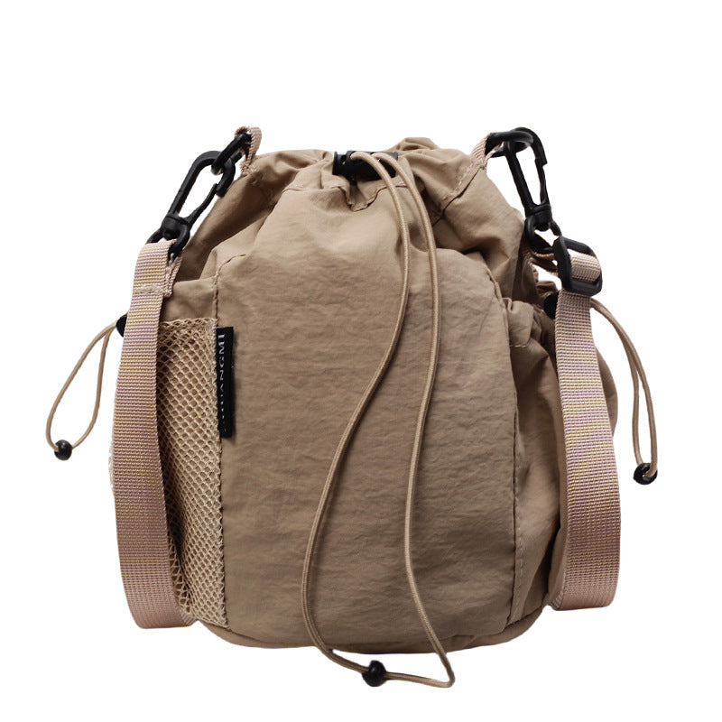 New drawstring bundle hand carry bucket bag  simple casual versatile shoulder bag outdoor commuter messenger women's bag