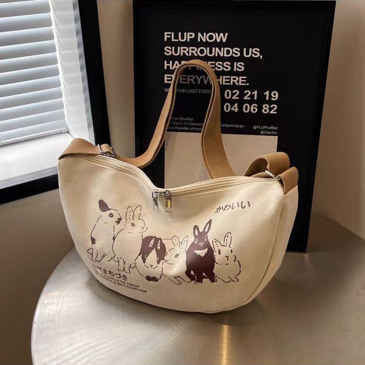 Niche style canvas bag for women 2024 spring and summer new arrivalcasual large capacity student shoulder work clothing bag crossbody dumpling bag