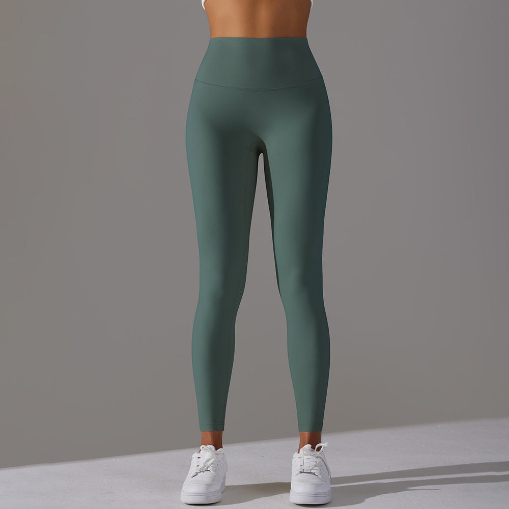 High-waisted, barely-there yoga pants for women, designed with a no-ride-up waistband for a seamless look. these figure-hugging, peach-shaped leggings offer a lift and a comfortable, stretchy fit, perfect for workouts and fitness activities. custom manufa